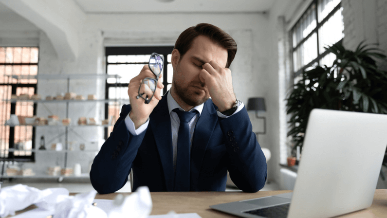 Tired manager overload with paperwork, feeling fatigue and burnout at workplace.