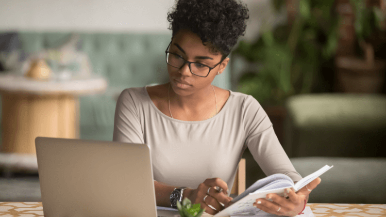 Focused young woman in eyeglasses